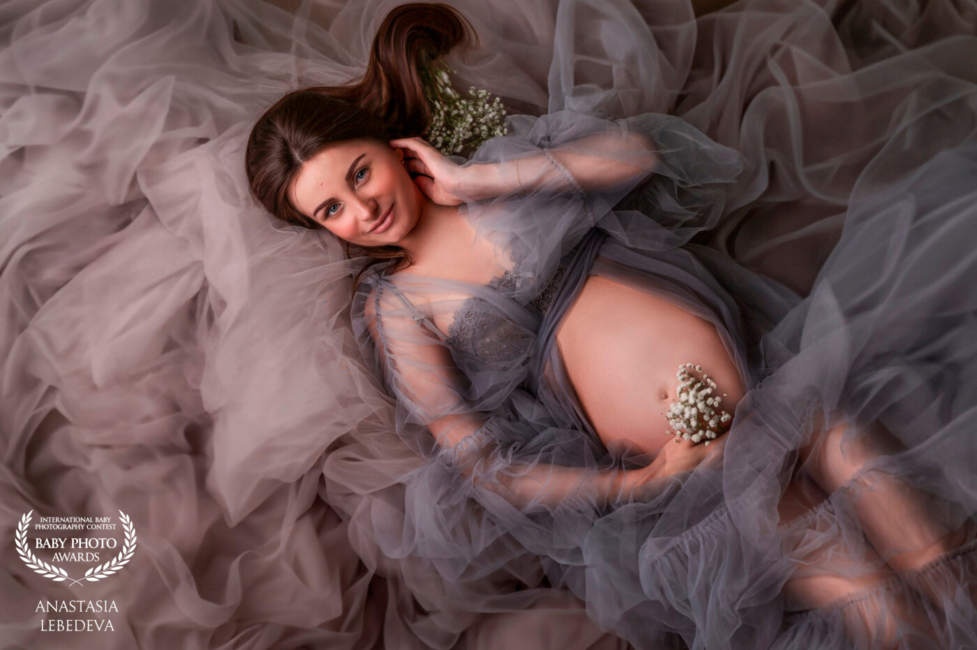 In this photo, a beautiful woman is expecting a baby. I really love photographing pregnancy, because women during this period are the most feminine, sensual and beautiful.