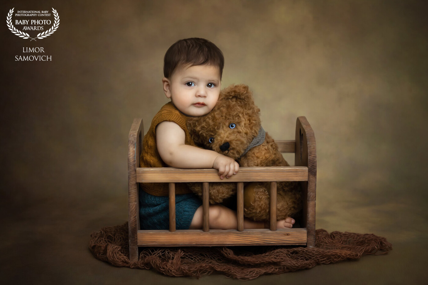 This 7 month old baby boy did not want to be next to this teddy bear. We tried to make him laugh and then we got a second..<br />
Lucky me, I was ready with my camera!