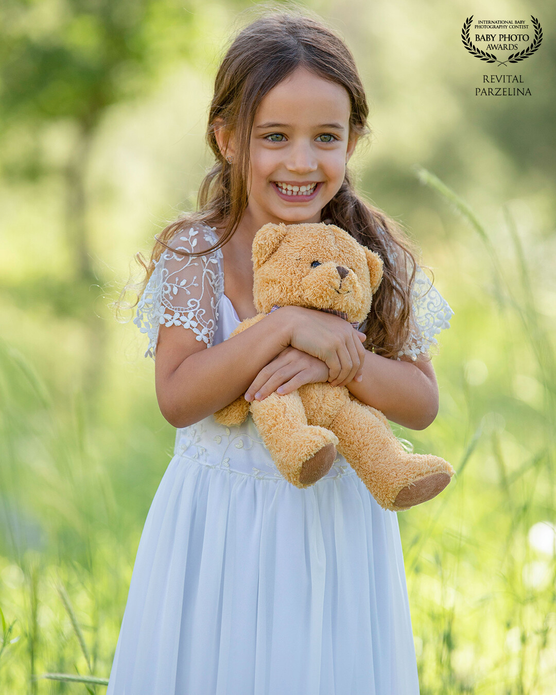 "With boundless joy, a girl embraces her teddy bear, radiating happiness in a tender moment that captures the purest essence of childhood bliss."