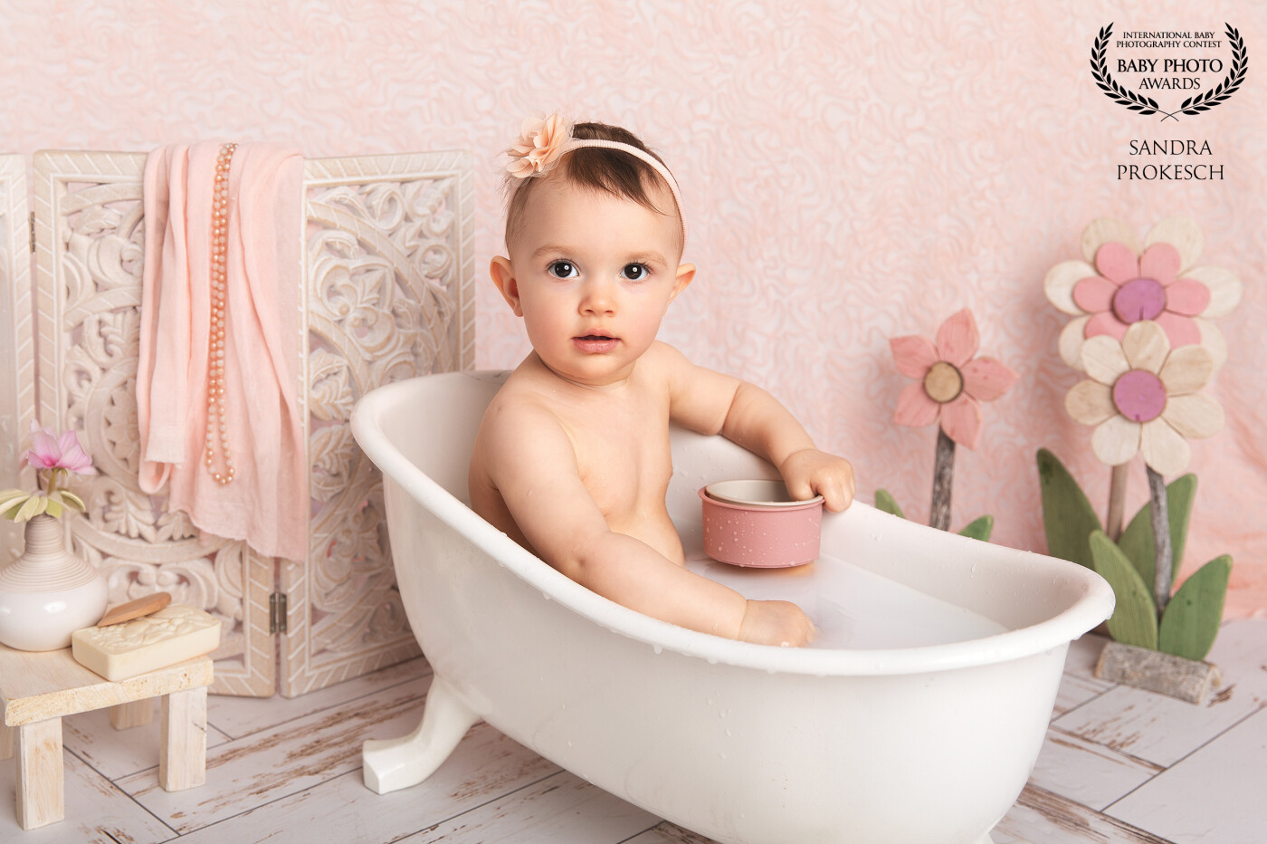 This enchanting photograph captures a sweet baby in a vintage bathtub, surrounded by cheerful flowers. The soft colors and playful expression perfectly embody the innocence and joy of childhood. <br />
This image serves as a beautiful reminder to cherish the little things in lifeโa smile, a splash of water, and the sparkle in a child's eyes. A true treasure that touches the heart and evokes a sense of nostalgia!