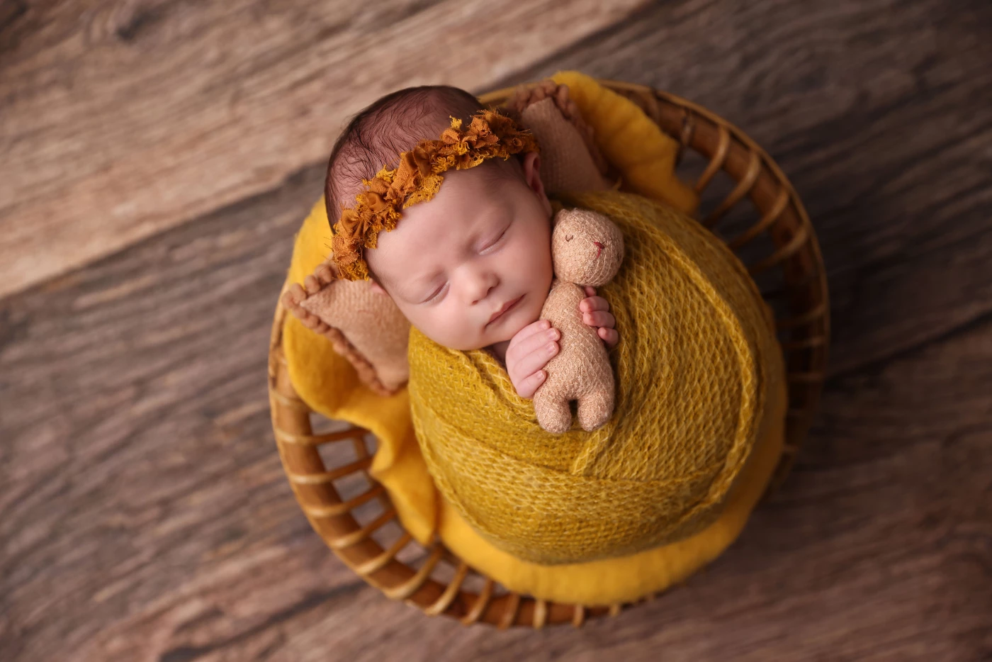 Wrapped in sunshine and dreams, holding tight to the tiniest teddy — a little bundle of calm in a go...