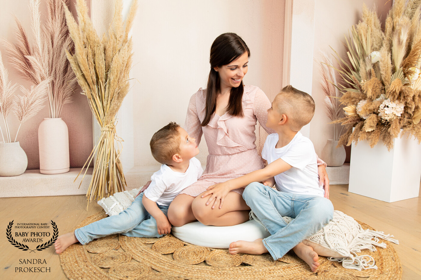 This heartwarming image captures a loving mother surrounded by her two wonderful sons, who feel like family to me. She is a loyal returning client, and I truly appreciate her trust and connection. This photo was taken for Mother's Day and perfectly encapsulates the deep bond between mother and children. The affection and joy they share reflect the essence of love and family. It is a true treasure to be able to capture such moments.