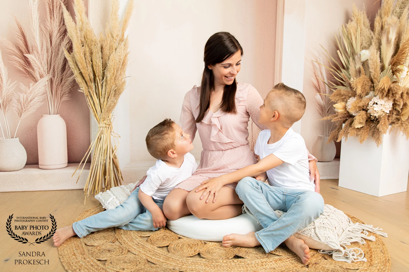 This heartwarming image captures a loving mother surrounded by her two wonderful sons, who feel like family to me. She is a loyal returning client, and I truly appreciate her trust and connection. This photo was taken for Mother's Day and perfectly encapsulates the deep bond between mother and children. The affection and joy they share reflect the essence of love and family. It is a true treasure to be able to capture such moments.