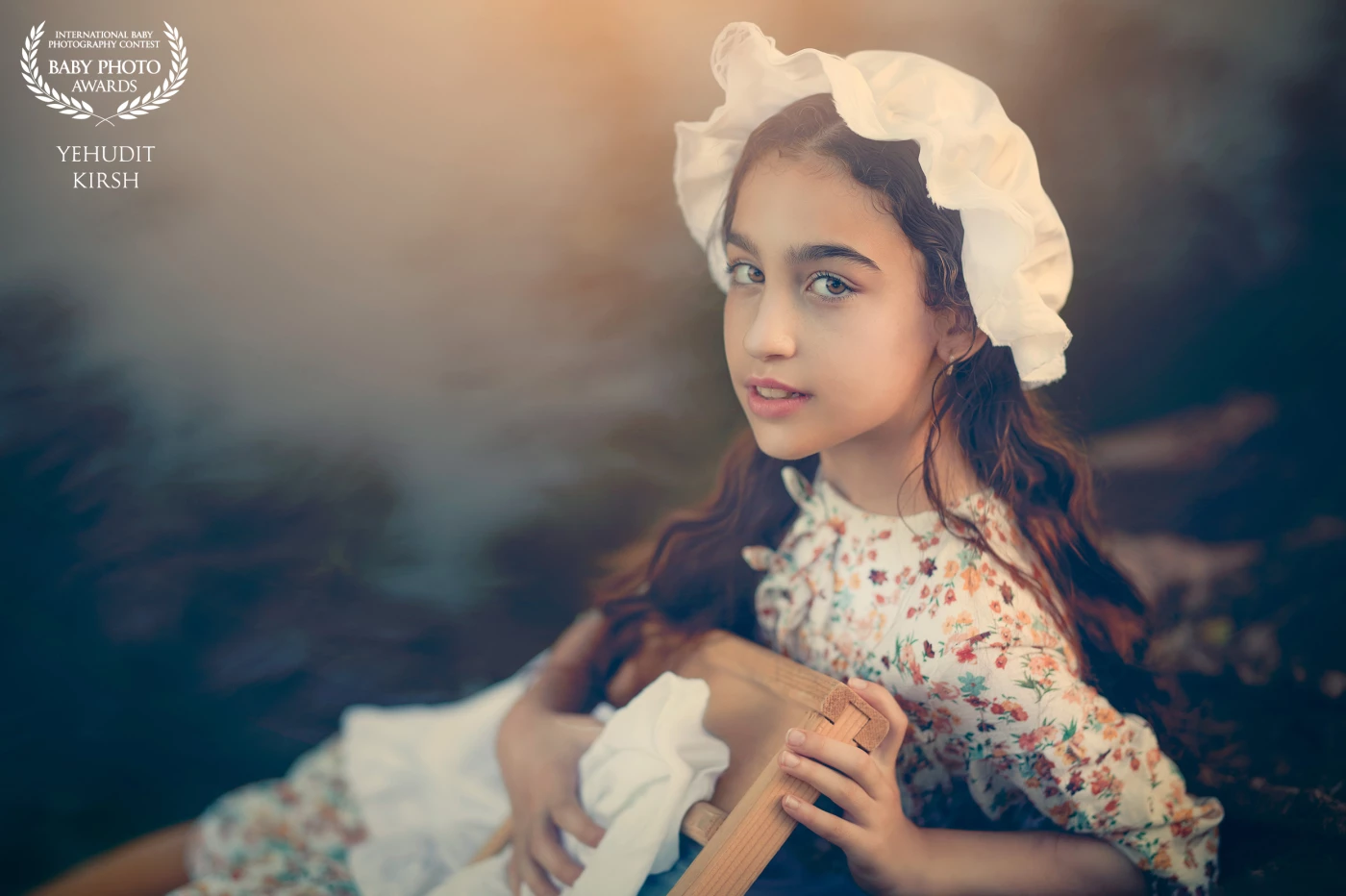A young girl, dressed in vintage attire, kneels by the stream as she washes clothes by hand. The scene carries a nostalgic, almost timeless quality — a quiet glimpse into simpler days, where nature and daily life intertwined. Her presence by the water, framed by the natural landscape, evokes both innocence and resilience.