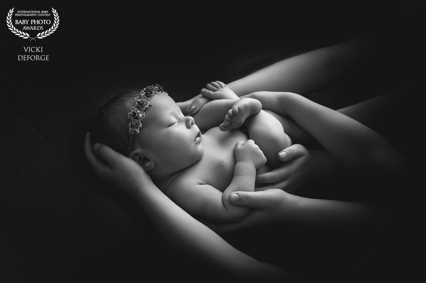 Baby sister safe in the hands of her three older sisters. Taken in studio in Kawartha Lakes, Ontario Canada.