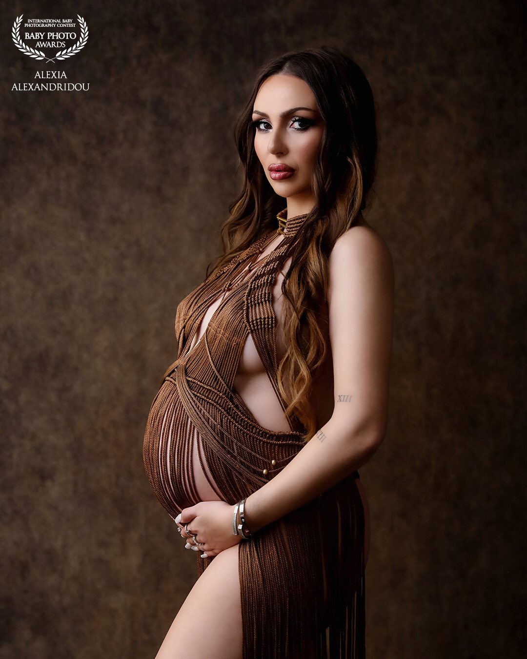 In a world where strength, beauty, and the miracle of life converge, there was a dynamic woman embracing the journey of motherhood. She radiated confidence, grace, and an undeniable power that inspired those around her. To celebrate this transformative phase of her life, she embarked on a maternity photo session that captured the essence of her unique spirit.