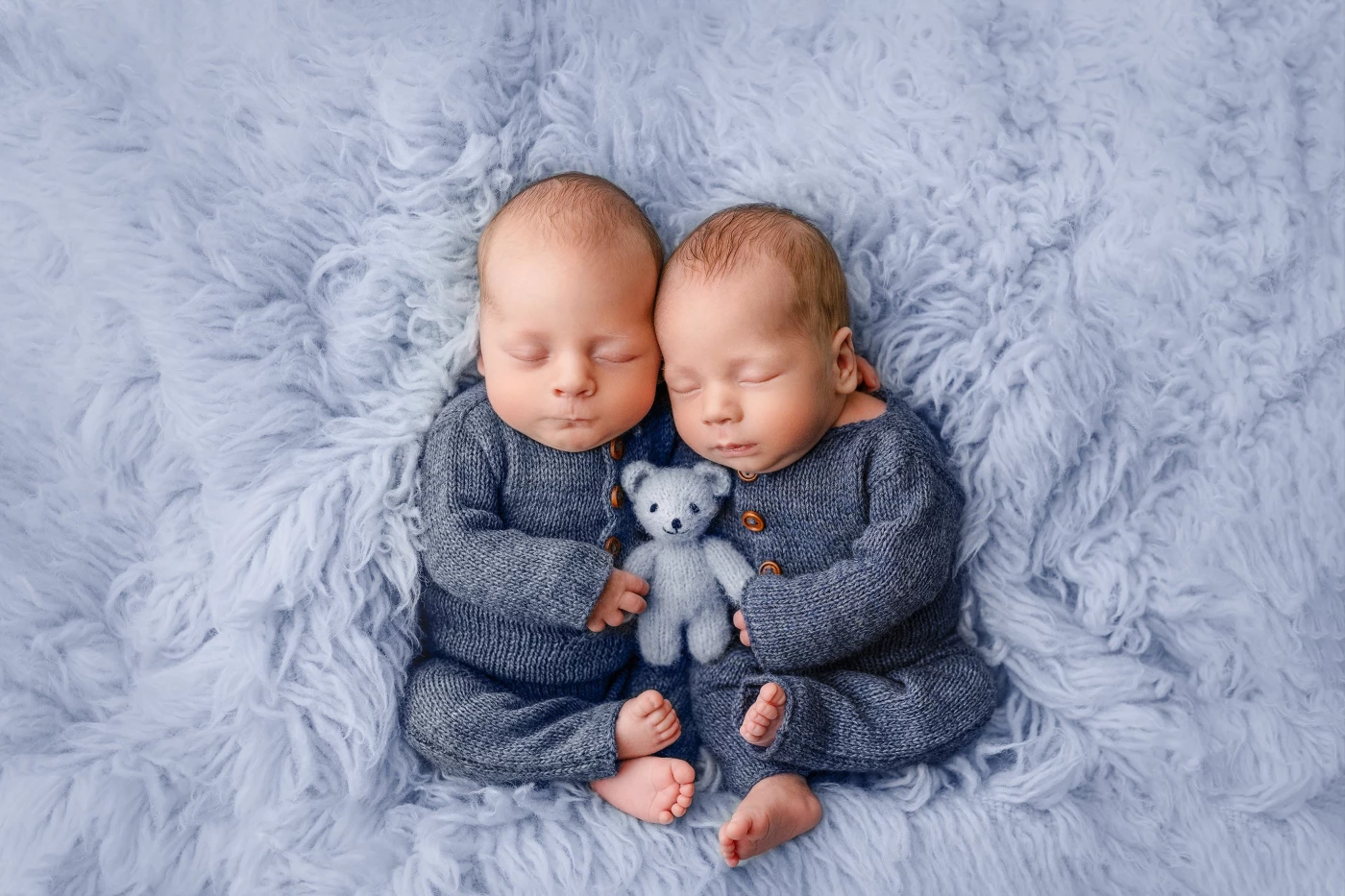 I had the privilege of photographing a beautiful twin duo recently. Originally expected to arrive in February, these two boys surprised everyone by coming a few weeks early, adding to the excitement.<br />
<br />
During their newborn session, they were absolutely amazing. Their adorable presence filled the room, and I captured a stunning series of photos, immortalizing their tender and pure moments.<br />
<br />
It was an honor to capture these precious moments. Each photograph from their newborn session is a treasured reminder of the joy this twin duo brings. I hope these images will always remind their parents of the invaluable connection their boys share.