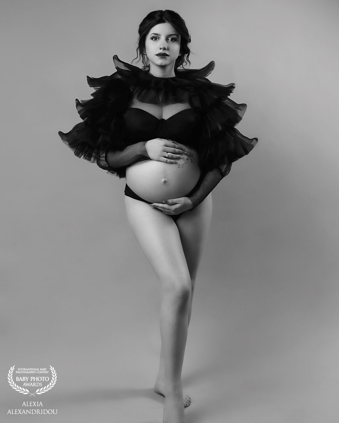 "In timeless shades of black and white, a moment of pure beauty unfolds. Capturing the essence of motherhood, where strength, grace, and anticipation intertwine. Embracing the simplicity and power of this journey. 🖤